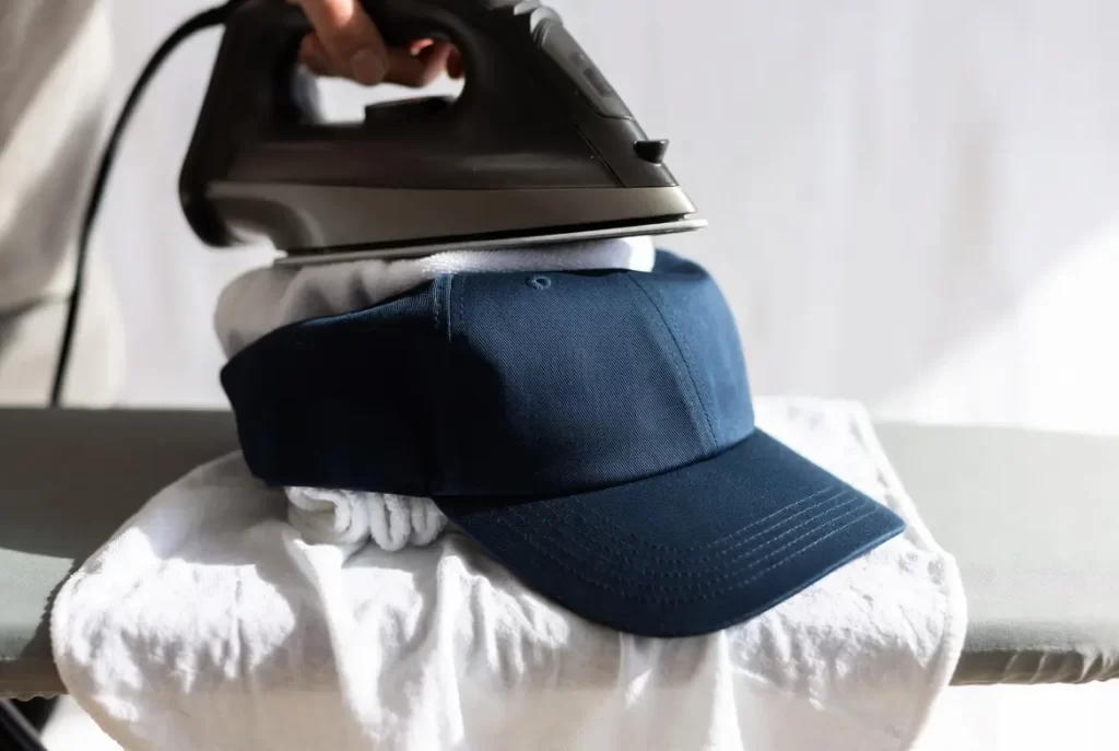 Fixing baseball cap with iron heat