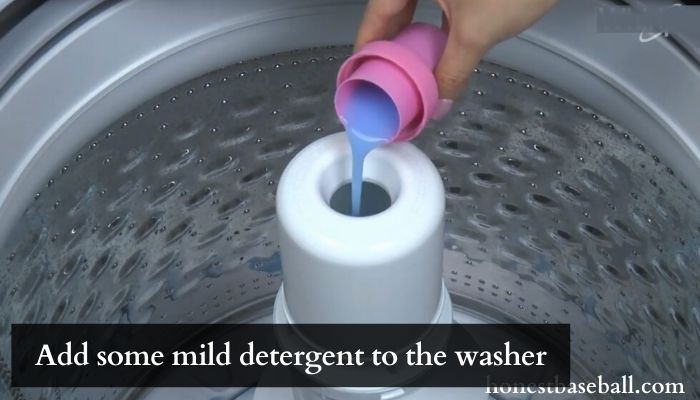 Add some mild detergent to the washer