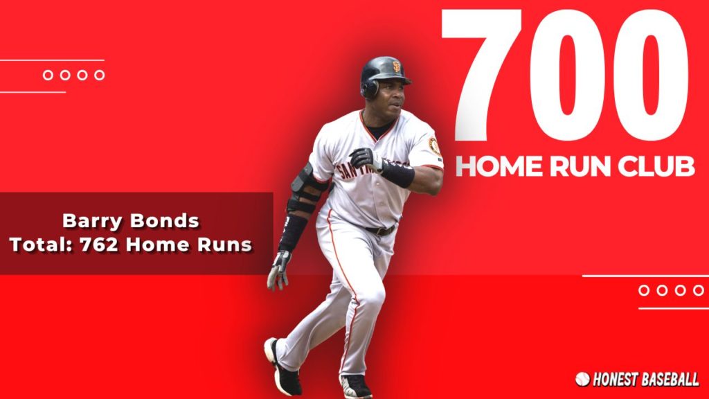  Barry Bonds swings his bat after hitting his 700th home run, with a determined expression on his face.