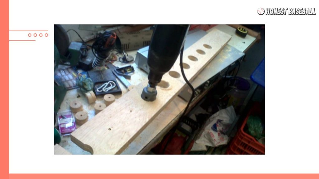 Figure 5 Creating holes with a drill machine on the wooden bat holder.