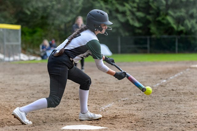 A baseball player with batting gloves 